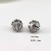 Aleación de plata de Xizang Zakiram pequeño colgante charm lateral, collar y pulsera DIY hechos a mano, accesorios de buena suerte al por mayor