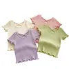 Camiseta Corta de Manga Corta con Espalda Cruzada de Moda para Niñas 2026 Verano Nuevo Estilo Coreano Color Sólido Versátil Casual para Niños