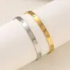 Pulseira Cruz de Aço Titânio Ouro 18K Transfronteiriça para Mulheres, Moda de Alto Padrão, Estilo Simples de Casal, Fábrica de Pulseiras Estilo Cartier