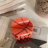 Acessórios de cabelo YHJ novo design clipe de basquete grampo de rúgbi coque na parte de trás do cabelo meio rabo de cavalo clipe de tubarão adorno de cabeça
