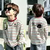 Camiseta de algodón puro a rayas de manga larga para niño, modelo nuevo 2026, camiseta base con estampado de dibujos animados para niños para ropa exterior de primavera y otoño