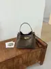Bolsa de ombro tipo balde, transfronteiriça, de nicho, alta qualidade e estilosa para mulheres, novo design estilo coreano, bolsa de ombro e bolsa transversal da moda para o dia a dia
