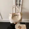 Bolso Cubo de Diseño Nicho Coreano Transfronterizo Retro 2026 Nuevo Super Popular de Venta Caliente Bolso Pequeño Transversal Texturizado
