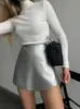 Estilo Europeu e Americano Outono e Inverno Moda Elegante Couro PU Cor Sólida Colagem Costura Zíper Cintura Alta Quadril Shorts Saia
