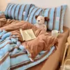 Nuevo conjunto de cuatro piezas estilo INS de blogger coreano, a rayas, de pelo de conejo grado A, terciopelo de leche, adecuado para dormitorios universitarios, también disponible como conjunto de tres piezas
