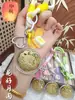 Regalos del Festival del Medio Otoño para Clientes: Pasteles de Luna, Bolsas de la Suerte, Dijes Dorados para Teléfono, Llaveros, Cadenas para Teléfono, Dijes para Bolsos