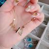 Colar de arco de água-marinha brilhante banhado a ouro 18K Oito coração oito flechas jóias Zircon Aqua Blue Bow Earrings