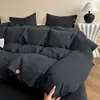 Nuevo conjunto de cuatro piezas de algodón y lino estilo botón simple de lujo ligero, estilo minimalista de Instagram, conjunto de tres piezas de hilo de rizo de algodón puro para ventas transfronterizas