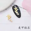 Joyería para uñas de estrella y luna nueva de网红 (Net Red), diamantes de alto color, perlas, estrella y luna, decoraciones de uñas diy, venta al por mayor