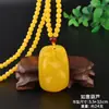 Venta al por mayor de fábrica colgante de resina imitación cera de abeja aceite de pollo gota de agua collar bolsa de la suerte cadena para suéter joyería larga estilo étnico para hombres y mujeres