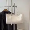 Bolso tote de nicho retro de color sólido para mujer, nuevo bolso de hombro grande de alta capacidad para ir al trabajo, bolso de mano de moda simple y versátil