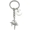 Llavero Popular de Cuatro Puntas Cruz Estrella Luna Transfronterizo Moda Colgante Decoración Simple para Bolso Amazon