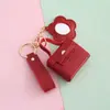 Colgante de Almacenamiento para Bolso Pequeño Estilo Coreano con Espejo Bolsa para Auriculares Llavero Colgante Bolso Mini de Piel Sintética Llavero