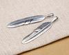 Joyería de plata de ley S925 al por mayor moda japonesa y coreana Takahashi Wu Lang pluma simple collar para hombre y mujer cadena de suéter colgante