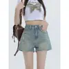 Shorts de mezclilla vintage de color claro para mujer, estilo fino de verano, 2026 modernos versátiles nuevos de cintura alta línea A rasgados hot pants