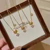 Colar Flor Anel Corrente para Correr Trevo de Quatro Folhas Brilhante Palácio Vintage Luxo Leve Versátil Corrente para Clavícula para Mulheres