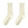 Calcetines blanco leche calcetines de tubo medio para mujer primavera y verano Joker color liso calcetines de felpa calcetines de punto de lunares calcetines de luna lateral de oreja de madera venta al por mayor