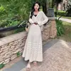 Nuevo conjunto de dos piezas para mujer de verano: suéter de punto hueco, camisa de aire acondicionado, top, cárdigan, chaqueta y falda para mujer
