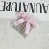 Cinta de tela elegante estilo hada con flores pequeñas y accesorio para el cabello de lazo, peine para peinado de corona alta
