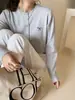 Casaco Suéter Feminino 2026 Outono Novo Estilo Outono/Inverno Cardigan Malha de Outono Top Primavera/Outono
