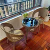 Juego de tres piezas de ratán mesa y sillas de balcón silla de ocio sala de estar exterior silla de ratán mesa de café silla giratoria mesa redonda juego de cinco piezas ratán de imitación