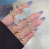 Novos brincos de franja de concha de pérola da moda 2023 femininos longos elegantes simples personalidade all-match Brincos Super Fada