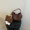 Bolso de cubo de nicho nuevo transfronterizo 2026, versátil y elegante, bolso de hombro y bandolera, bolso de mano con cadena, bolso vintage para madre e hija