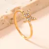 Anillo Transfronterizo Nuevo de Acero Inoxidable para Mujer Estilo Frío Dorado Simple Lujo Ligero Diamante Micro 1.5mm Anillo de Acero de Titanio Fábrica