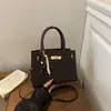 Bolsa elegante e minimalista de PU trançado para mulheres, nova coleção 2026, bolsa de ombro, bolsa transversal, adequada para o trajeto diário e negócios, bolsa quadrada pequena, bolsa de mão