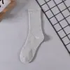 Meias para Homens e Mulheres Cano Longo Cor Sólida Desodorante Absorvente de Suor Respirável Esportivas Basquete Meias Masculinas Primavera e Outono Esportivas de Algodão Atacado