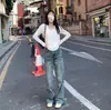 2025 Início do Outono Cor Pura Branco Decote V Solto Preguiçoso Elástico Manga Longa Camiseta Feminina Solta Estilo Coreano Aparência Emagrecedora Roupa de Baixo