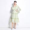 Vestido cruzado de primavera 2025, nuevo vestido largo con flores huecas bordadas, corte entallado y mangas farol de longitud media.