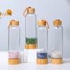 Suministro de fábrica grava de cristal natural energía Vaso de vidrio tapa de bambú con cuerda Vaso de spa Vaso para la salud al por mayor