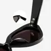 Fabricantes de gafas de sol de ojo de gato de moda para platos lote mixto multicolor estrella con temperamento montura negra gafas de sol negro gris
