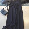 Estambre japonés ~ pantalones negros de talle alto capullo corte vertical plátano para mujer diseño primavera temprana 2025