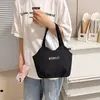 Bolso de hombro de lona para mujer 2026 nuevo modelo simple versátil bolsa tote gran capacidad bolso de mano para ir al trabajo bandolera casual