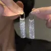 Novos brincos longos de franja de alto padrão para o verão de 2024, brincos femininos com temperamento europeu e americano, brincos de cobre com zircônia incrustada, atacado