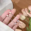 Aretes largos de borla con perla de cola de pez de circón, elegantes y lujosos, nicho, exquisitos, de alta gama, estilo de doble uso