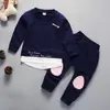 Ropa Infantil de Cuello Redondo para Niños y Niñas, Primavera 2026, Conjunto de Dos Piezas de Sudadera y Pantalón Largo para Bebés y Niños, Ropa Infantil Estilo Coreano, Al Por Mayor