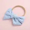 Diadema con lazo en forma de molino de viento de algodón y bambú para niños, muy vendida en Europa y América, de color sólido, súper suave y con anilla para el pelo para bebés.