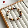 Pulsera de Madera Natural Dieciocho Semillas Hilo de Mano Hecha de Madera Original Estilo Étnico para Mujer Cuentas de Muchos Tesoros Wenwan Cuentas Budistas Cuentas de Oración Mano