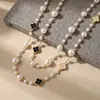 Collar de perlas vintage en capas, sensación de lujo ligero y alta gama, cadena versátil para suéter, accesorio de ropa popular de nicho para mujer