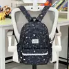 Diseño con ribete de encaje, mochila pequeña y femenina con estampado de estrellas de ensueño, adecuada para las salidas de fin de semana de los estudiantes de primaria, disponible en varios tamaños