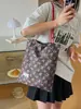 Bolsa de lunares de nicho súper popular estilo coreano para mujer 2026 Nueva bolsa versátil de un solo hombro para llevar debajo del brazo Bolsa pequeña de mano para salir a trabajar