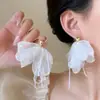 Pendientes de borlas de flores coloridas súper de cuento de hadas, pendientes de botón y argollas dulces de nicho de alta gama, pendientes exagerados estilo vacacional