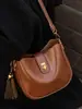 Bolso de Axila de Aspecto Retro de Alta Calidad para Mujer 2025 Nuevo Bolso Cubo Simple Textura de Nicho Hombro Único Cruzado Bolso para Teléfono Móvil