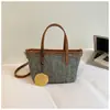Bolsa de Palha Tecida de Verão para Mulheres 2026 Nova Tendência Exquisita Bolsa Tote Vazada Versátil Bolsa de Ombro Transversal