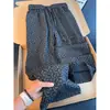 Pantalones casuales retro americanos con estampado de espinas para hombre, colección de otoño, estilo cleanfit, pierna recta, corte holgado y pantalones de pierna ancha fluidos
