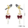 Pinzas sexys para pezones con pompones, moños y cascabeles, ajustables para estimulación del pecho y busto femenino, mayorista fabricante de productos para adultos
