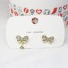 Nuevos 10 en stock al por mayor aretes de botón C aretes de perlas copo de nieve celebridad de internet pequeños aretes de botón de diamante de alta calidad lazo cara sonriente